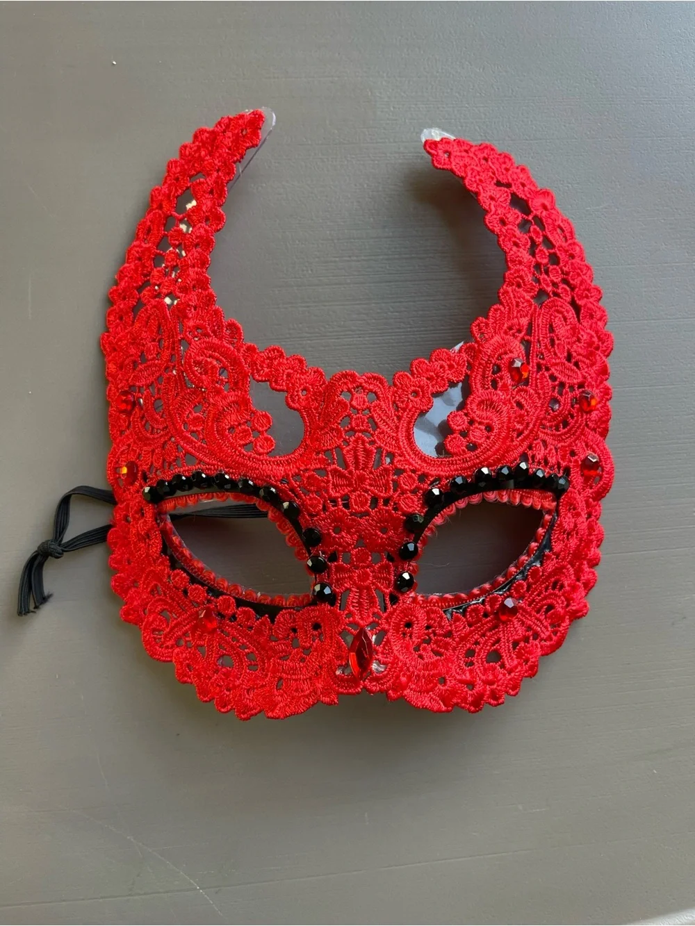 Red lace devil masquerade eye mask accented with black beading and a central red